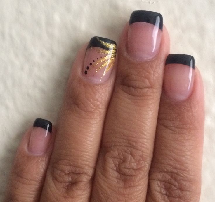 Sophisticated Black French Tip Nails with Gold Accents for Elegant Style.