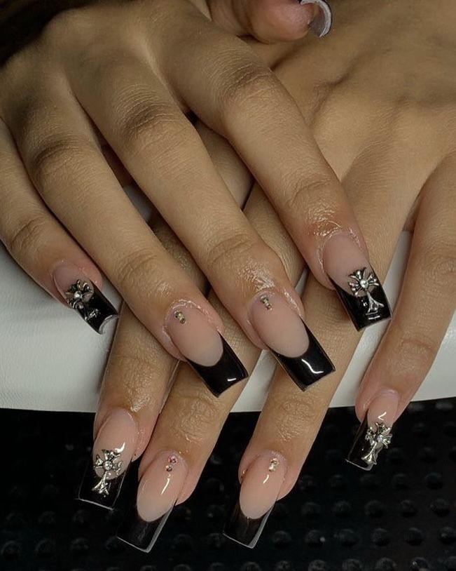 Chic Nude and Black Nail Design with Glamorous Floral Embellishments