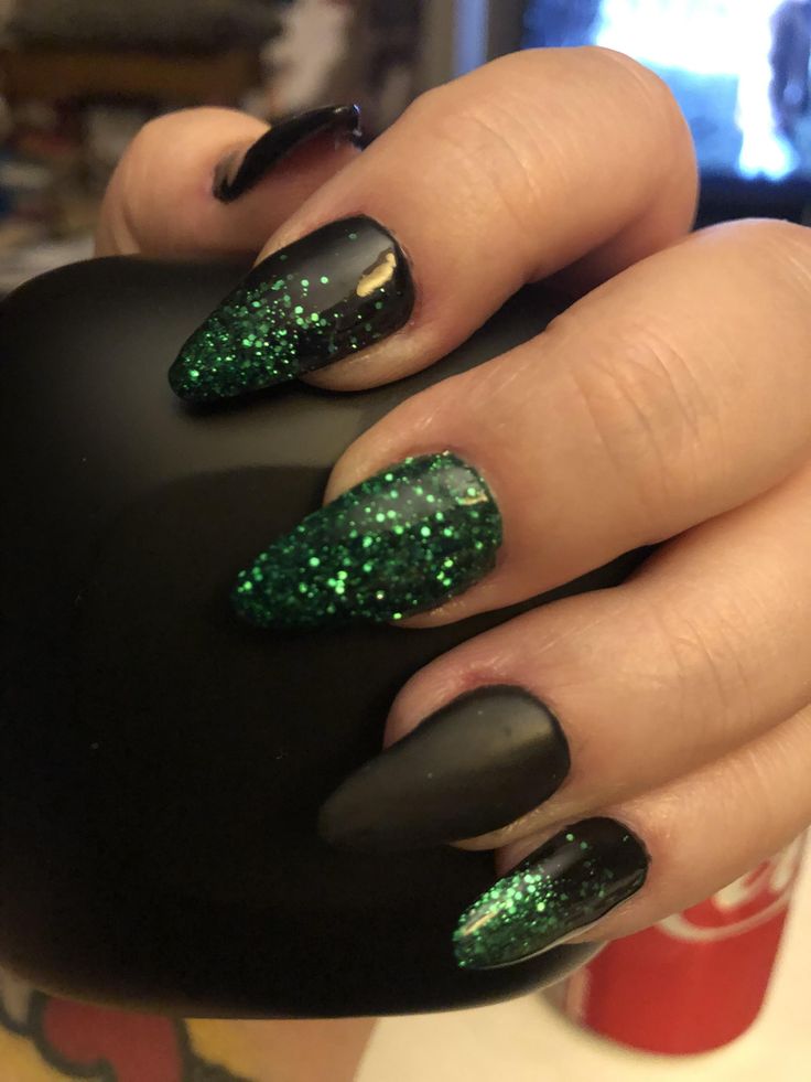 Bold Almond-Shaped Nail Design with Matte Black and Vibrant Green Glitter.