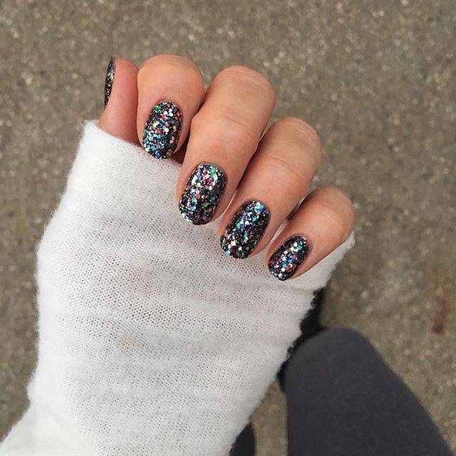 Sparkling Holographic Nail Design: A Chic Festive Touch for Any Occasion.