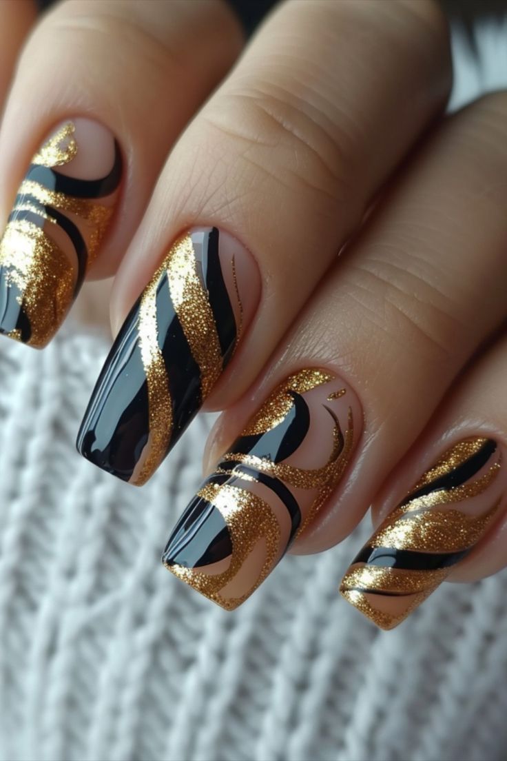 Elegant Black and Gold Nail Design: Glamorous Swirls for Bold Statements