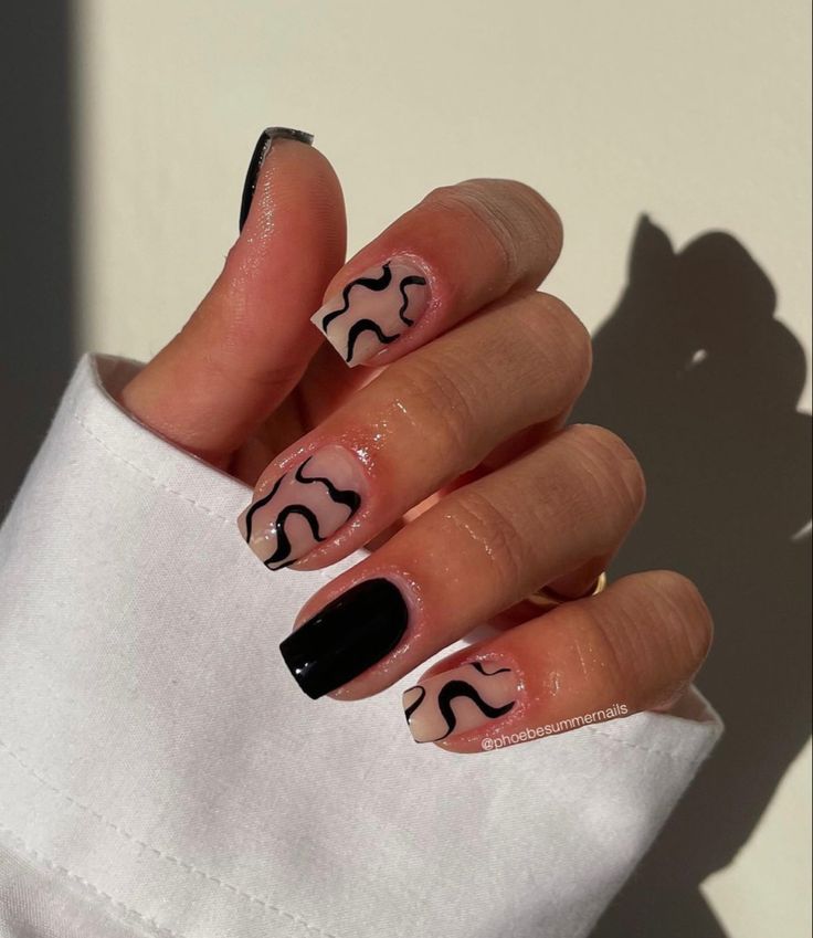 Chic and Playful Artistic Nail Design with Striking Color Contrast and Glossy Black Tips.