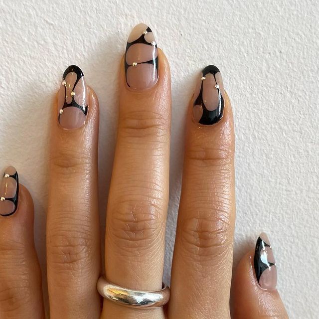 Modern Earthy Nail Design with Bold Black Lines and Glossy Accents.