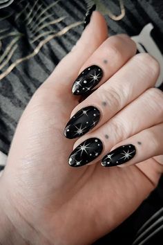 Celestial Elegance: Striking Black Starry Almond Nails with Silver Stars and Sparkle