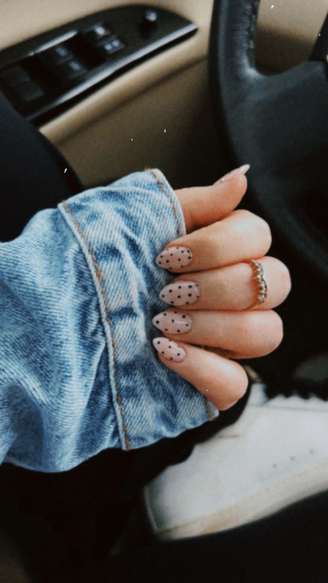 Chic Pastel Polka Dot Nail Design with Elegant Almond Shape and Casual Denim Jacket.