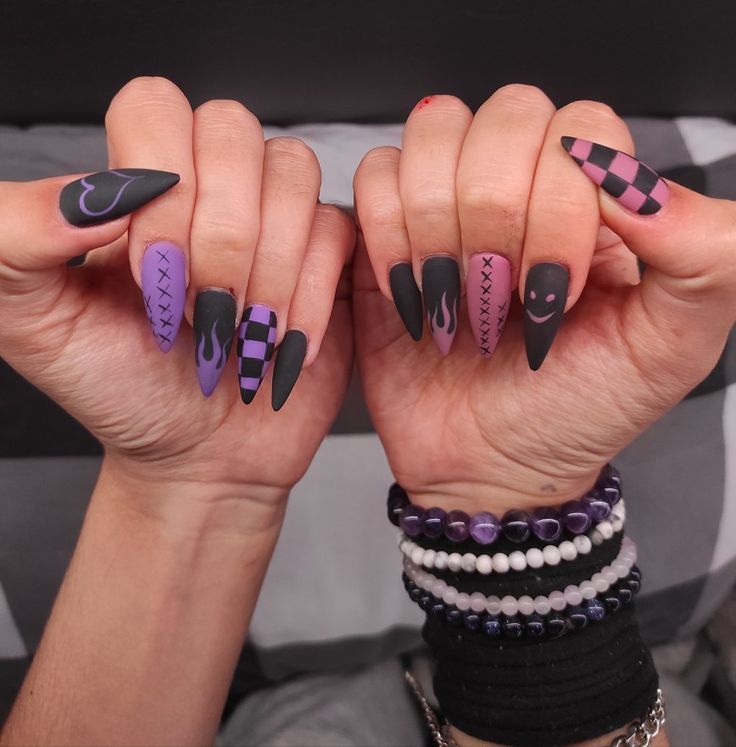 Edgy Stiletto Nail Design: Matte Black and Purple with Unique Patterns