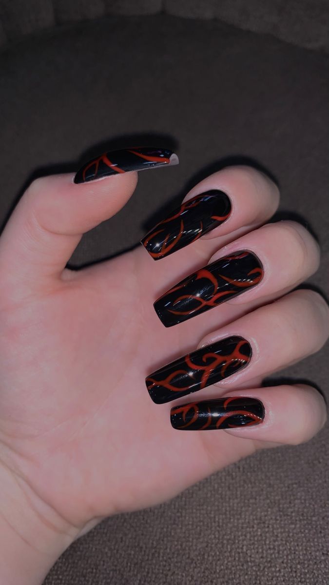 Edgy Glossy Black and Red Swirl Nail Design for a Bold Statement.