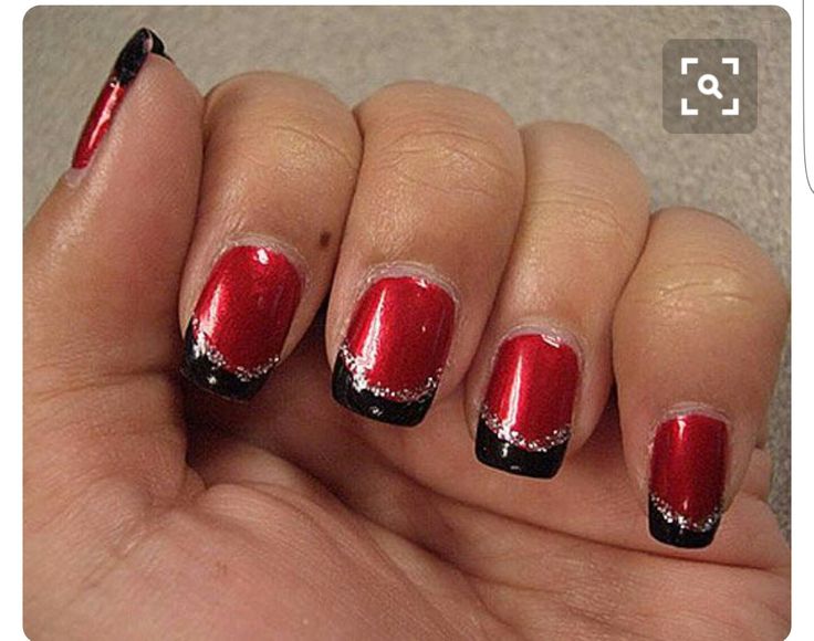 Chic Red and Black Nail Design with Glossy Finish and Intricate Detailing