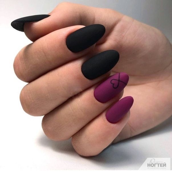 Sophisticated Matte Black and Deep Burgundy Nail Design with Elegant Heart Detailing.