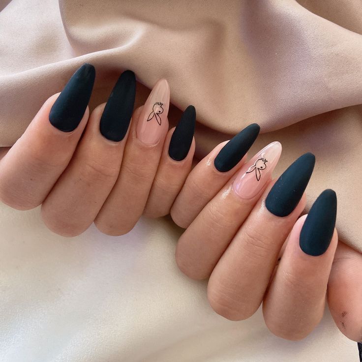 Elegant Matte Black and Nude Almond-Shaped Nail Design with Delicate Illustrations.