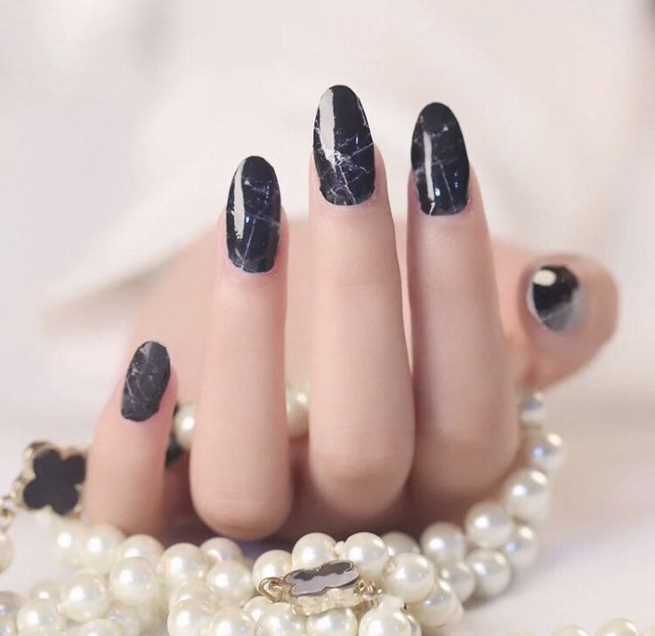 Chic Elegant Black Marble Nail Design with Glossy Finish and White Veins, Enhanced by Pearl Accents.