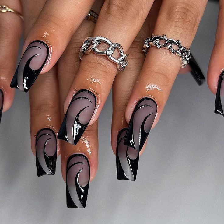 Chic Black and Nude Nail Design with Elegant Wave Patterns for a Bold Statement.