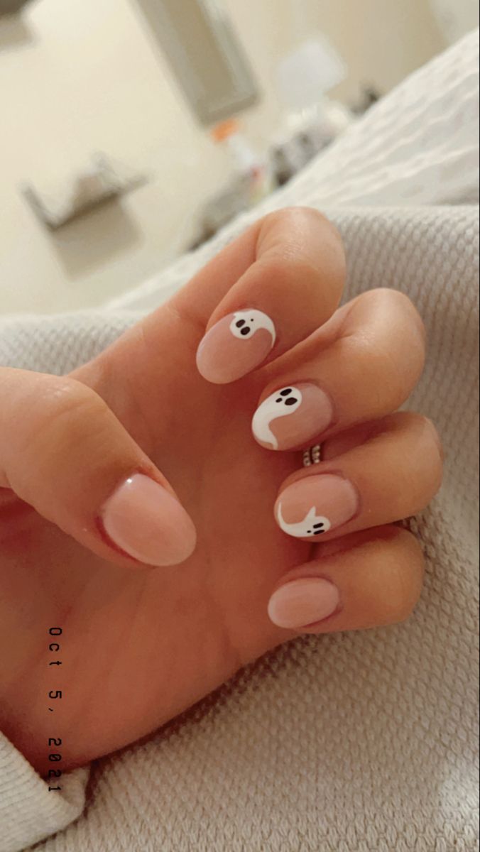 Whimsical Halloween Nail Design: Pink Base with Ghosts and Crescent Moons