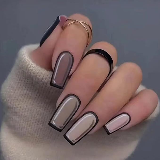 Chic Modern Nail Design with Muted Browns, Creams, and Bold Black Outlines.