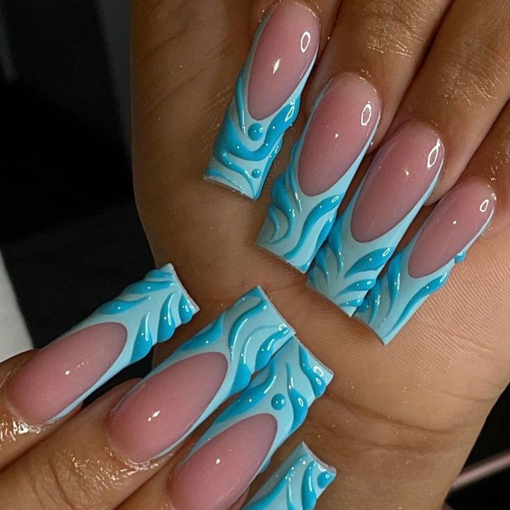 Vibrant Blue Swirl Nail Art: A Playful Contrast of Glossy Pink and Fluid Aqua Patterns.