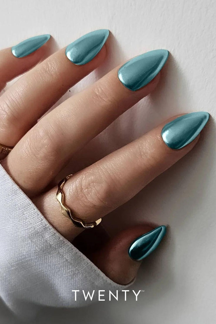 Chic Almond-Shaped Teal Nails with Glossy Finish and Gold Accents.