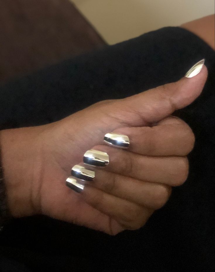 Sleek Silver Geometric Metallic Nail Design: A Bold, Modern Statement.