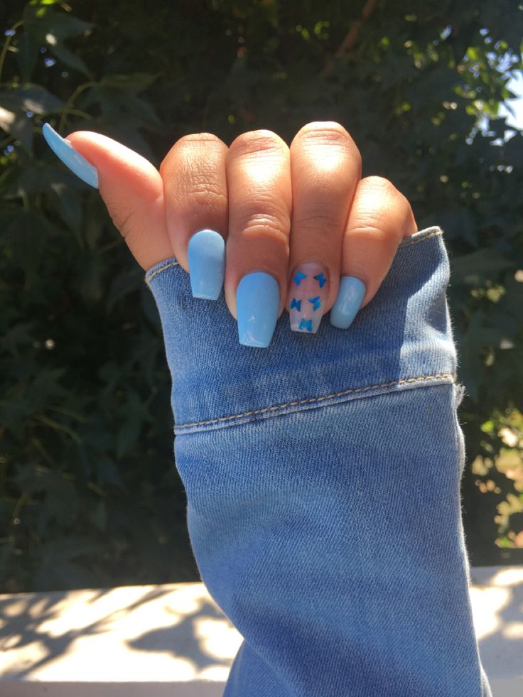 Whimsical Sky Blue Nail Design with Matte and Glossy Finishes for a Fresh Summer Look.