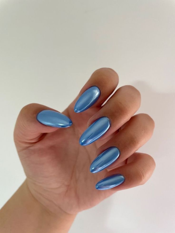 Chic Shiny Blue Almond-Shaped Nails with Iridescent Finish for a Sophisticated Look.