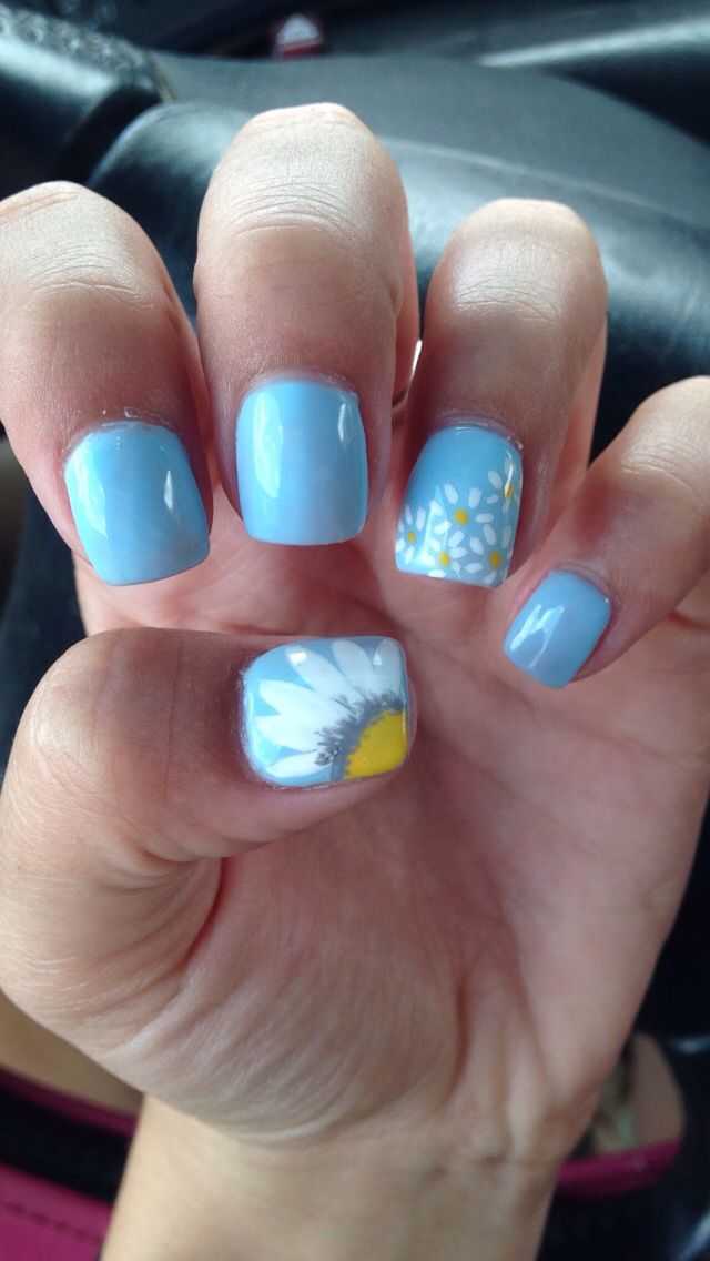 Whimsical Sky Blue Floral Nail Design for a Cheerful Spring Look.