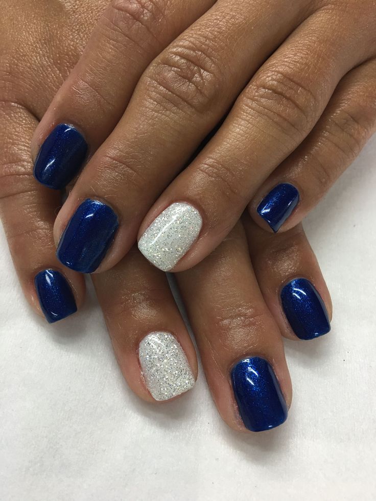 Bold Navy Blue and Sparkling Silver Nail Design: A Perfect Blend of Sophistication and Glamour.