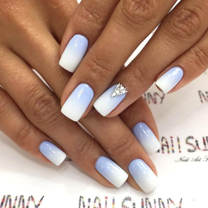 Elegant Gradient Nail Design in Soft Blue and White with Rhinestone Accent.