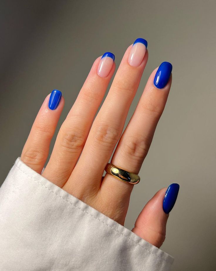 Chic Blue and Nude Nail Design: Bold Tips and Glossy Elegance for Any Occasion.