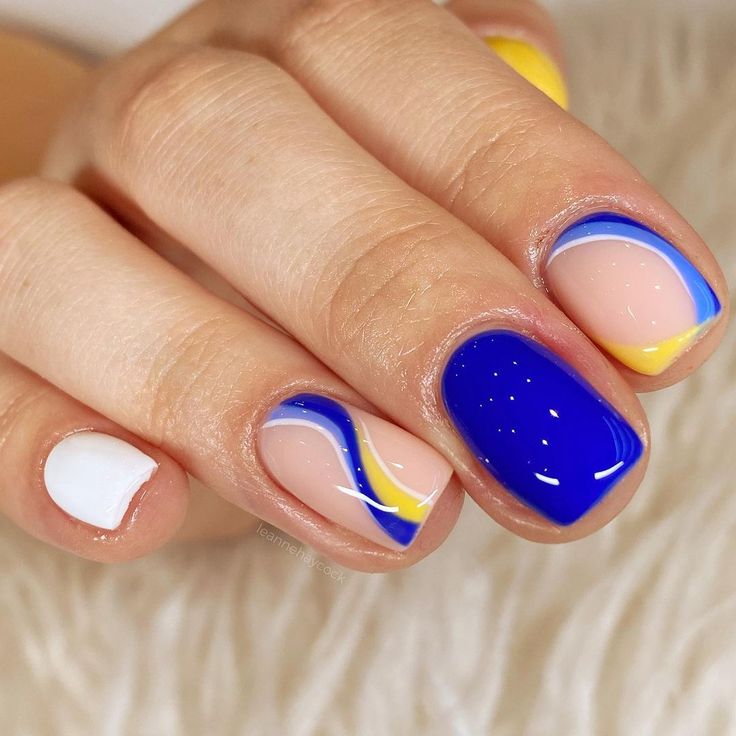 Playful Royal Blue, Nude, and Yellow Wavy Nail Design for a Modern Aesthetic