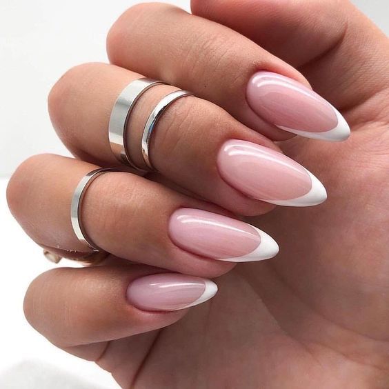 Chic Almond-Shaped Nude and White Nails: A Sophisticated Trend for Any Occasion