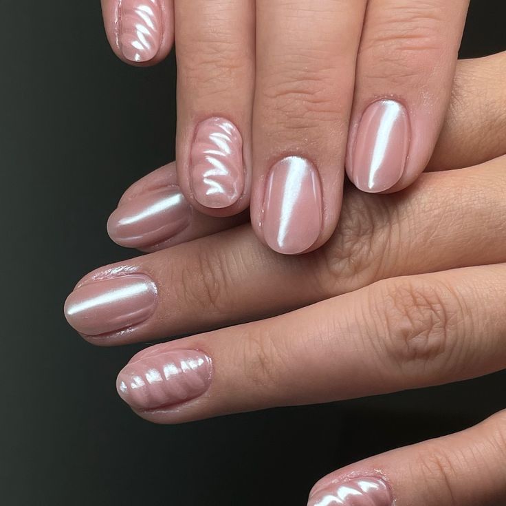 Sophisticated Soft Pink Nail Design with Textured Waves for Versatile Elegance.