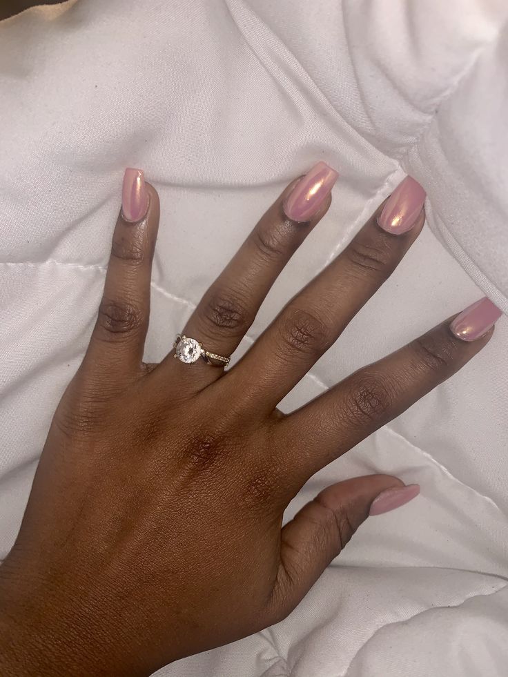 Sophisticated Elegant Nude Nails with Glossy Finish and Sparkling Accent