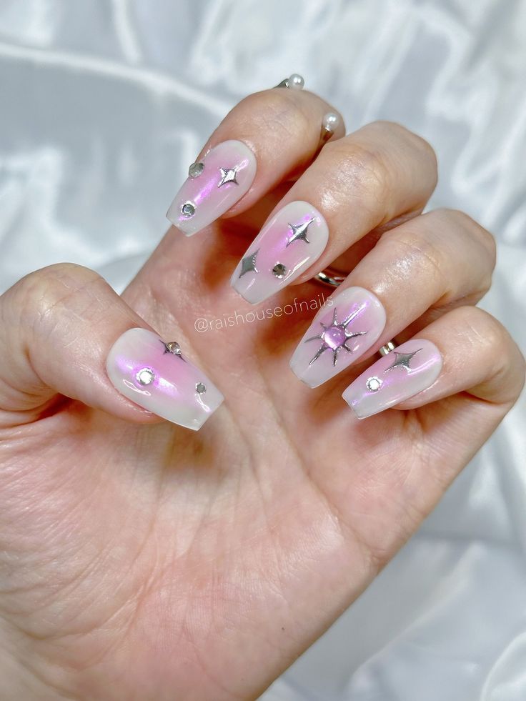 Whimsical Dreamy Pastel Nail Design with Gradient Pink and Silver Star Accents