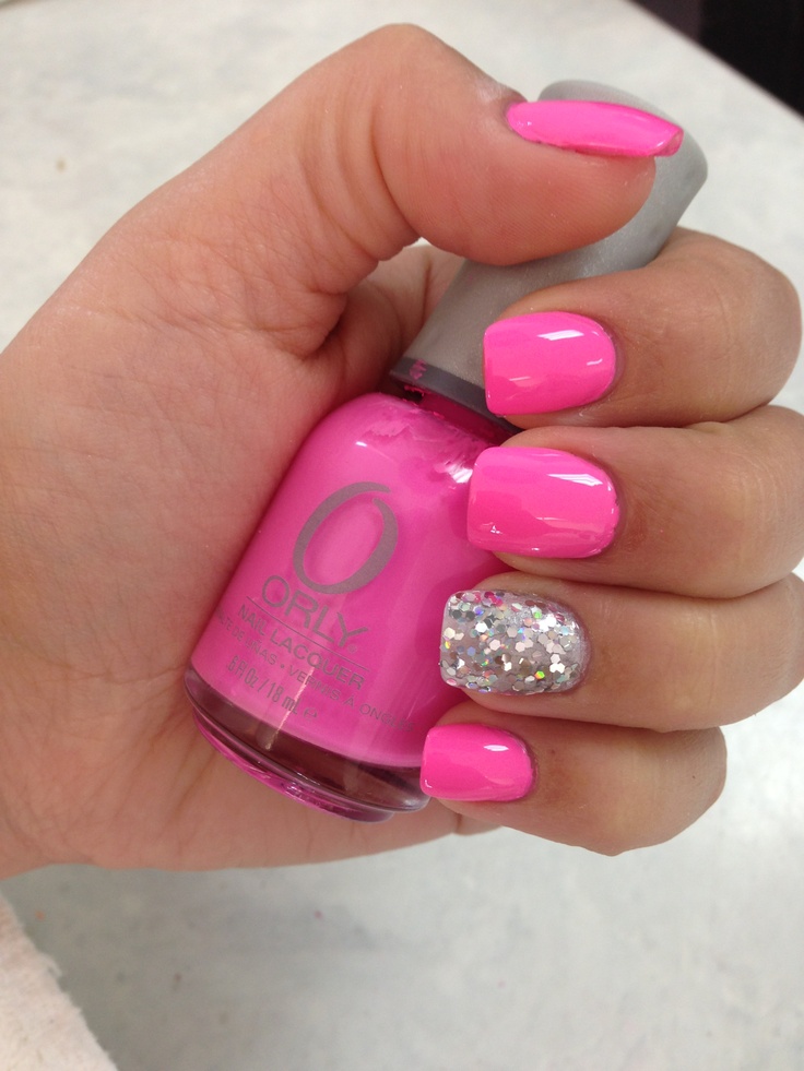 Vibrant Pink Nail Design with Glittery Accent for a Playful Summer Look