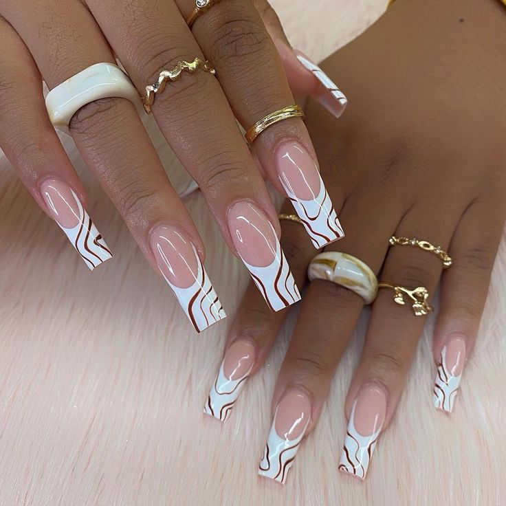 Chic Nude Square Nails with Elegant White and Brown Marble Tips Enhanced by Gold Rings.