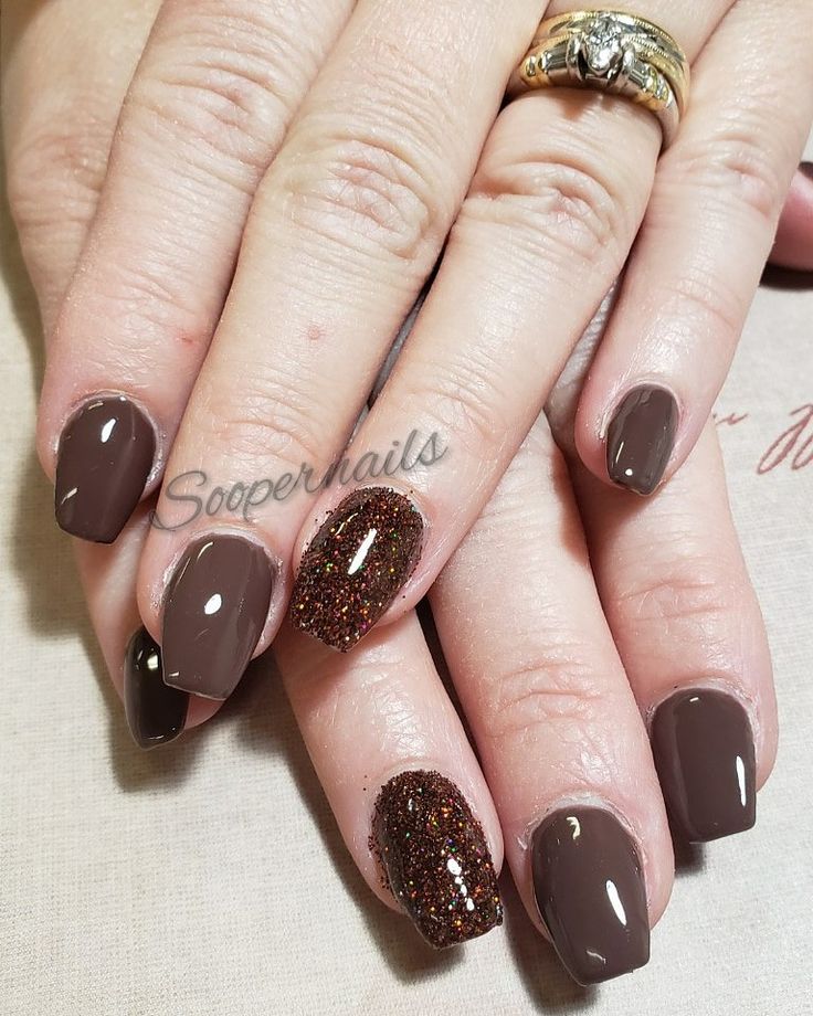 Sophisticated Chocolate Brown Nail Design with Glamorous Glitter Accents.