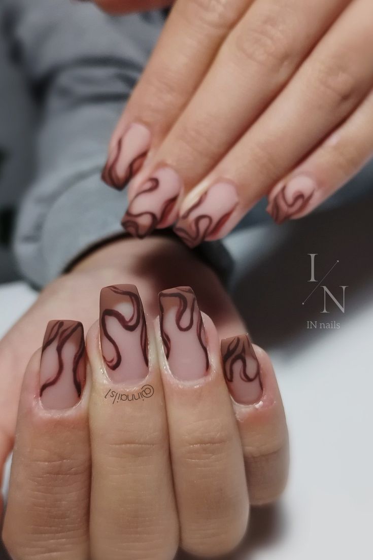 Chic Nude Nail Design with Flowing Brown Swirls and Glossy Finish