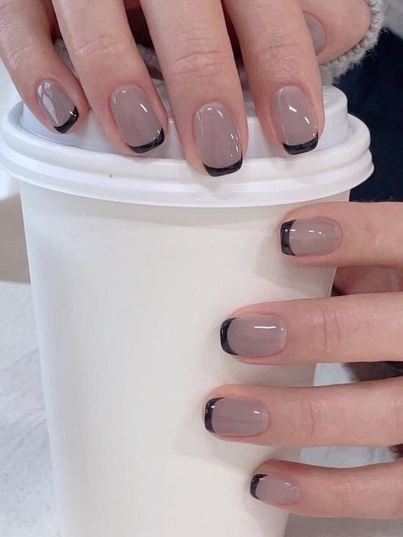 Chic Taupe Base with Sleek Black Tips: A Sophisticated Nail Design for Every Occasion.