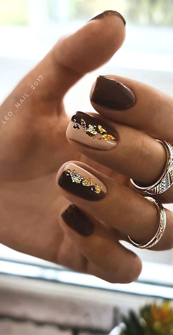 Sophisticated Chocolate Brown Nail Design with Shimmering Gold and Silver Accents