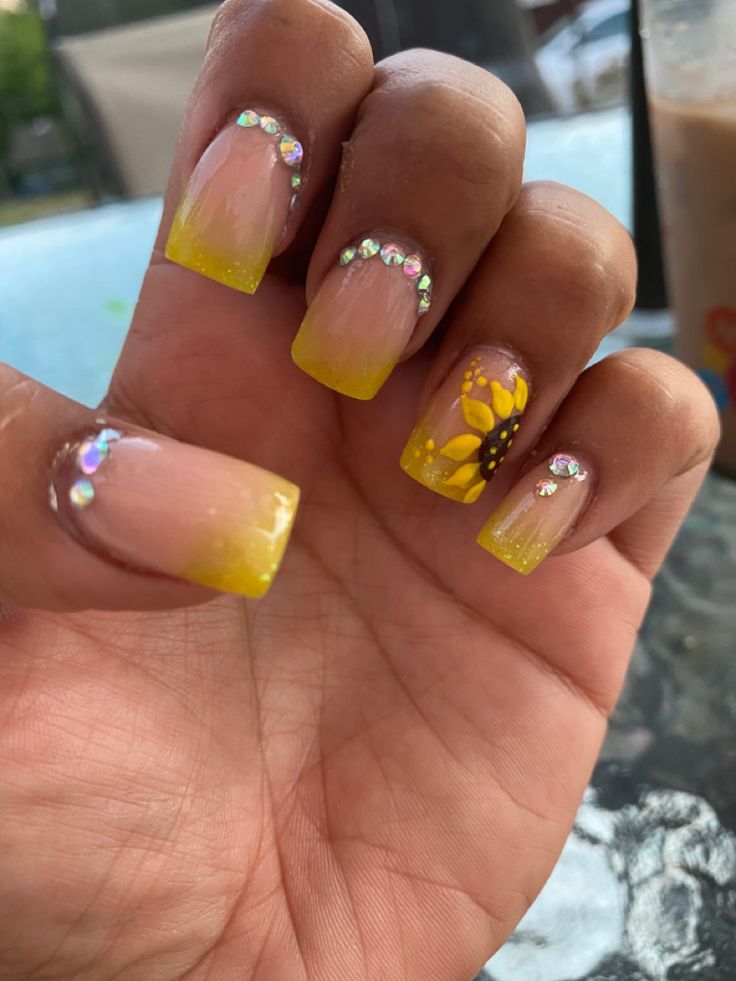 Cheerful Gradient Nail Design with Sunflower Accents and Rhinestones