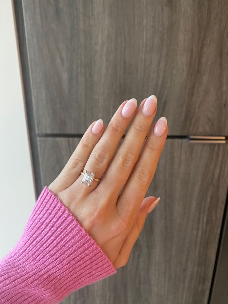 Sophisticated Almond-Shaped Nails in Soft Pink: A Chic and Elegant Design for Any Occasion.