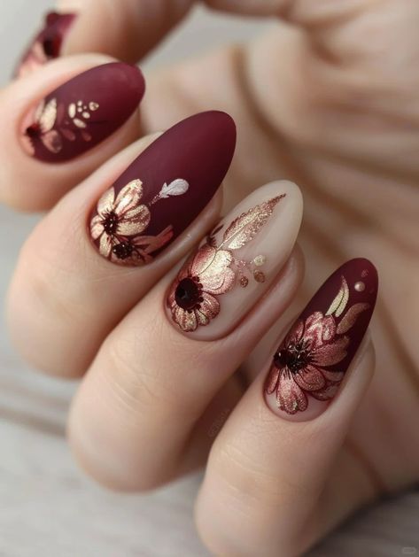 Sophisticated Floral Nail Art: Burgundy Base with Gold Foil and Gemstone Accents