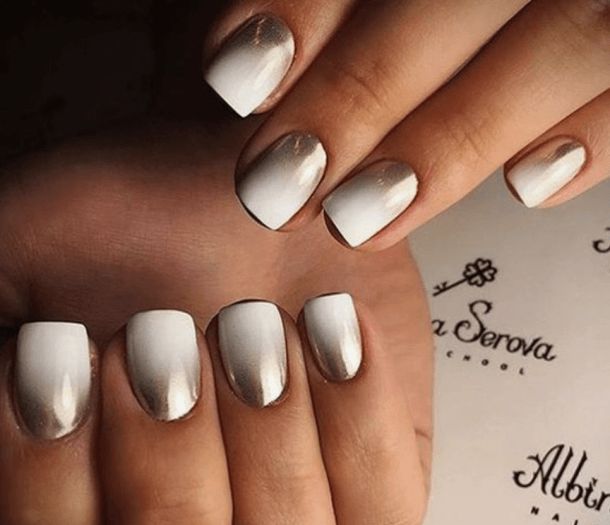 Sophisticated Ombre Nail Design with White and Metallic Tones for a Chic, Luxurious Look.