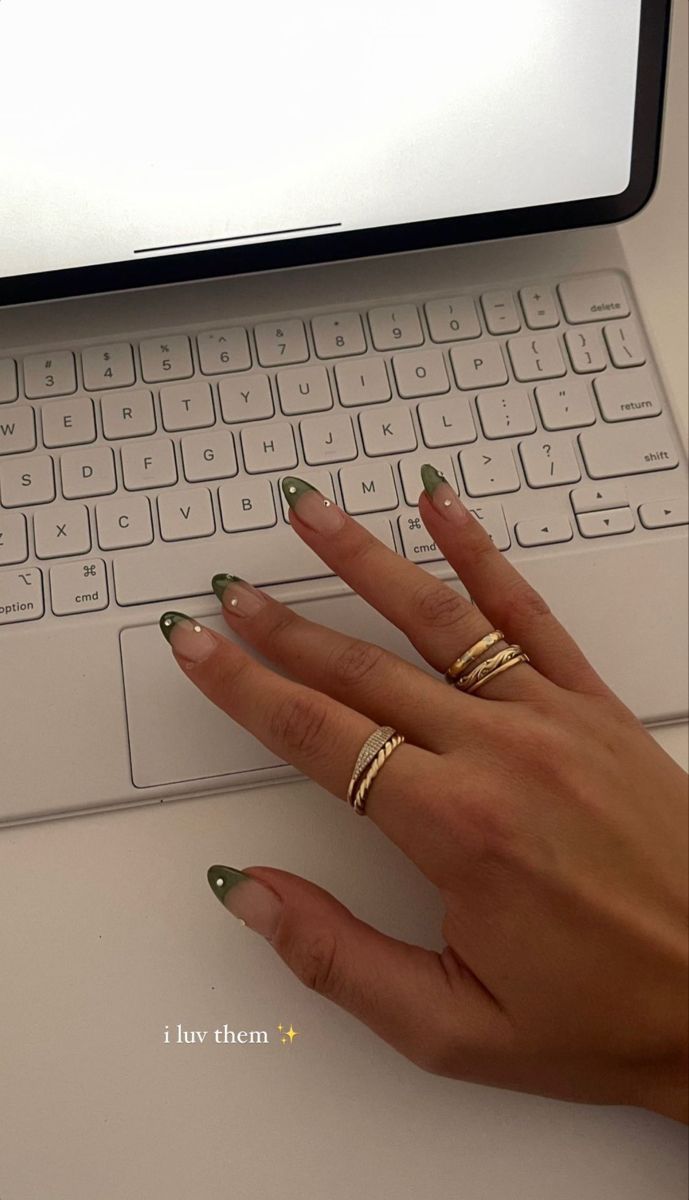 Chic Modern French Manicure: Soft Green with Nude Tips and Elegant Gold Accents.