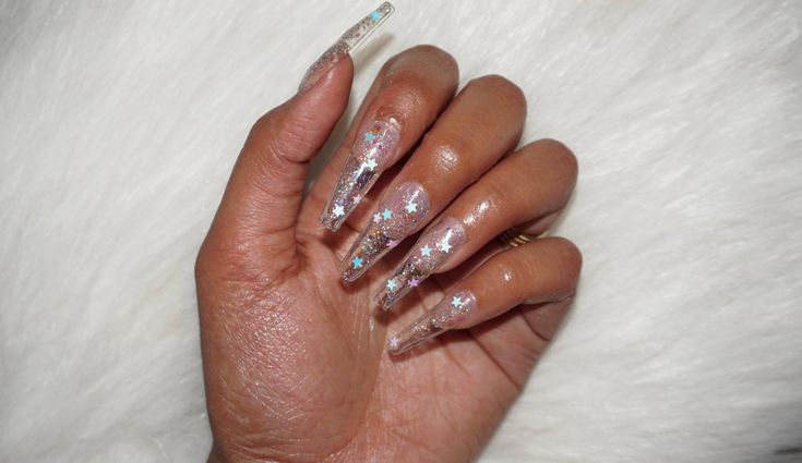 Whimsical Elegance: Glittering Star-Adorned Nail Art for Any Occasion