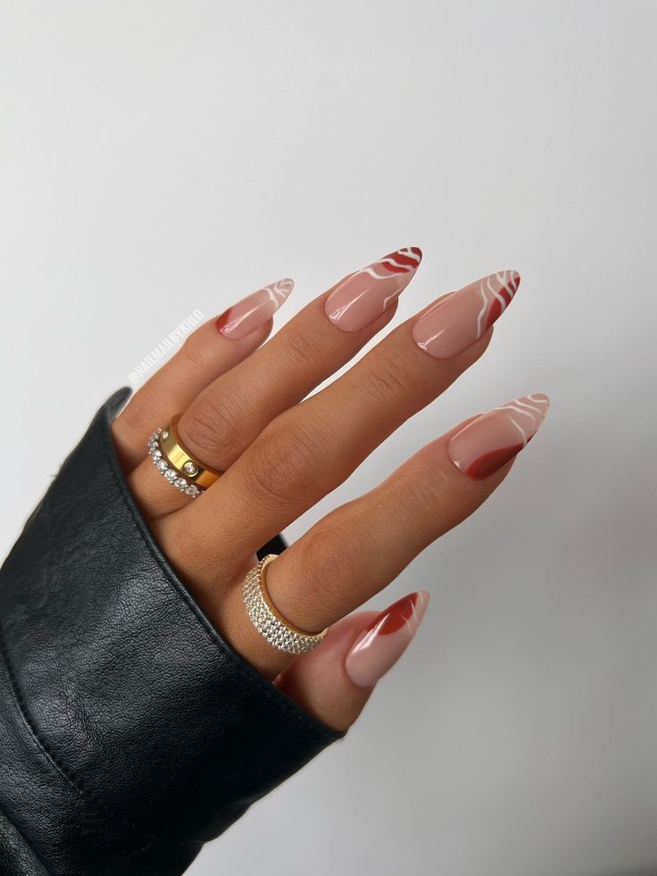 Chic Stiletto Manicure with Elegant Color Blend and Intricate Designs.