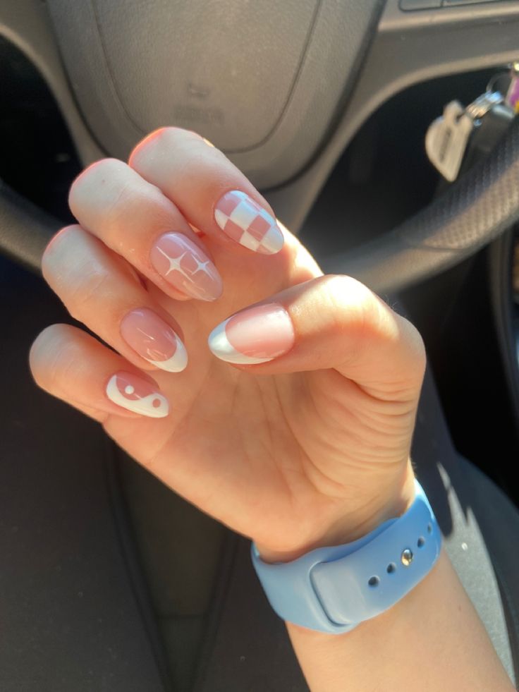 Elegant Nail Design: Playful Patterns in Soft Pink and Crisp White