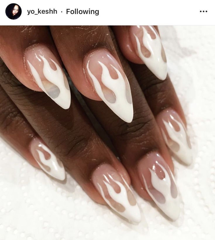 Flame-Inspired Almond-Shaped Nail Design: A Trendy Blend of White and Soft Nude Hues