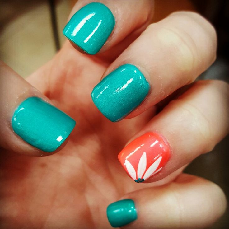 Vibrant Teal and Coral Nail Design with Floral Accent for a Fresh Spring Aesthetic.