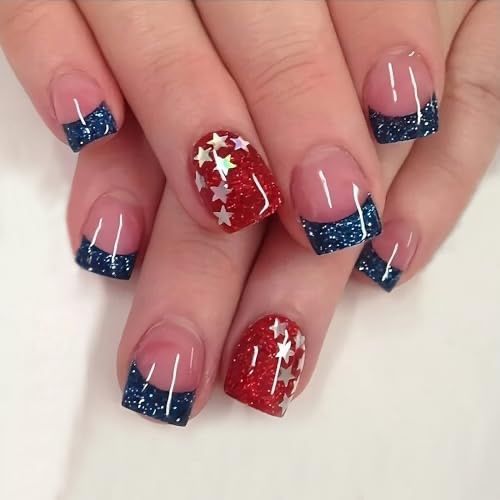 Patriotic Glittery Nail Design with French Tips and Star Accents.