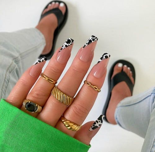 Chic Nail Design with Bold Cow-Print Tips and Glamorous Accessories in Vibrant Green Ensemble